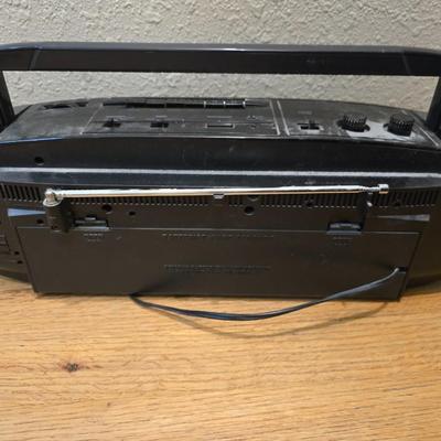RCA Dual cassette deck am/fm radio with assortment of books on tape