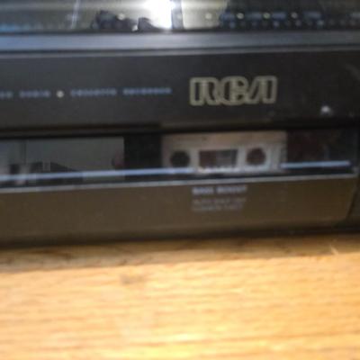 RCA Dual cassette deck am/fm radio with assortment of books on tape