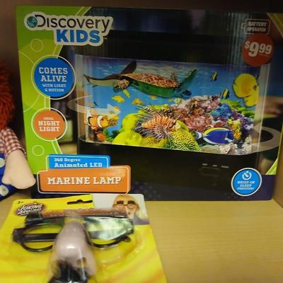 Raggedy Ann & Andy dolls and DVD movie with a discovery kids aquarium and a pair of funny glasses