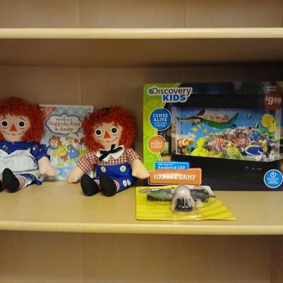 Raggedy Ann & Andy dolls and DVD movie with a discovery kids aquarium and a pair of funny glasses