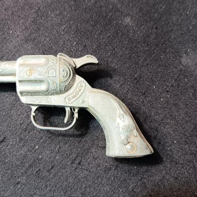 TOY WINCHESTER RIFLE AND A SMOKY CAP GUN