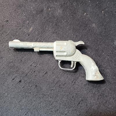 TOY WINCHESTER RIFLE AND A SMOKY CAP GUN