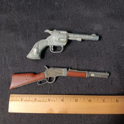TOY WINCHESTER RIFLE AND A SMOKY CAP GUN