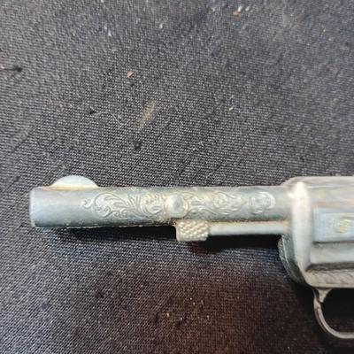 TOY WINCHESTER RIFLE AND A SMOKY CAP GUN