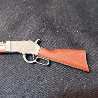TOY WINCHESTER RIFLE AND A SMOKY CAP GUN