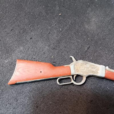TOY WINCHESTER RIFLE AND A SMOKY CAP GUN