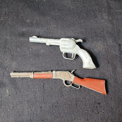 TOY WINCHESTER RIFLE AND A SMOKY CAP GUN