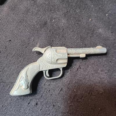 TOY WINCHESTER RIFLE AND A SMOKY CAP GUN