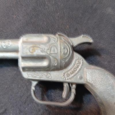 TOY WINCHESTER RIFLE AND A SMOKY CAP GUN