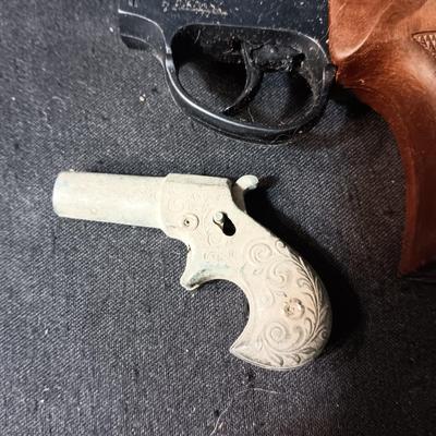 EDISON TOY CAP GUN MADE IN ITALY AND A VERY OLD DIE CAST TOY GUN