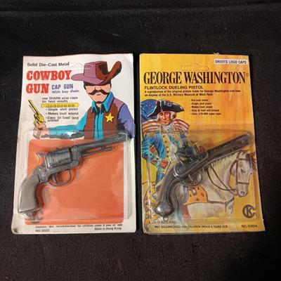 2 TOY GUNS SEALED ON CARDS