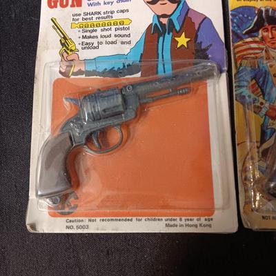 2 TOY GUNS SEALED ON CARDS