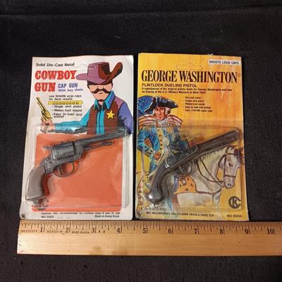2 TOY GUNS SEALED ON CARDS