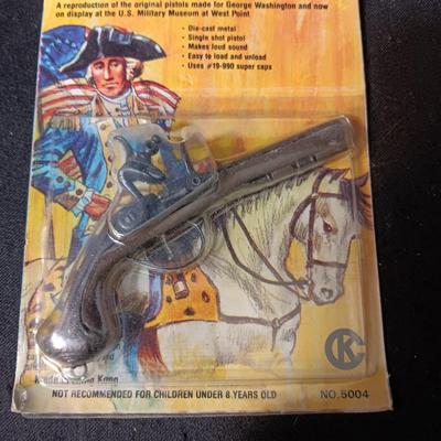 2 TOY GUNS SEALED ON CARDS