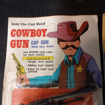 2 TOY GUNS SEALED ON CARDS