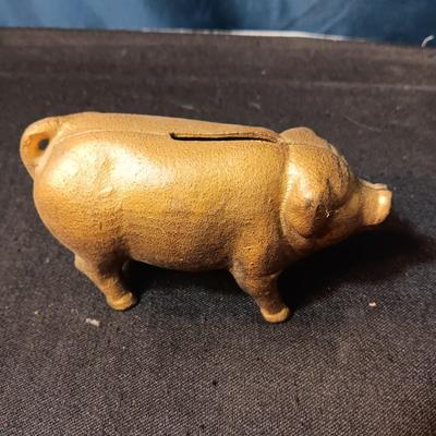 2 BRASS COLORED CAST IRON PIGGY BANKS