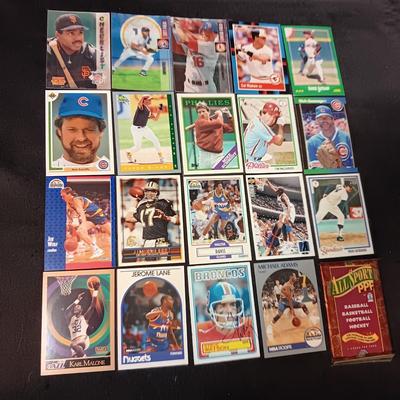 A VARIETY OF SPORTS TRADING CARDS