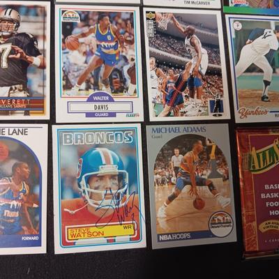 A VARIETY OF SPORTS TRADING CARDS