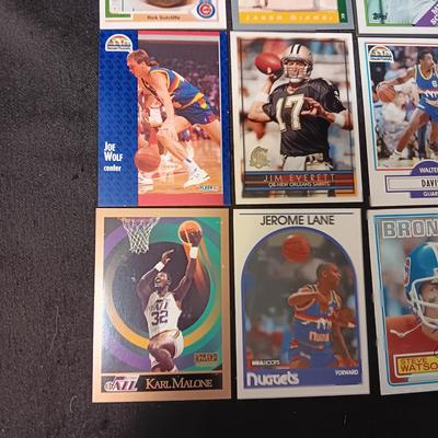 A VARIETY OF SPORTS TRADING CARDS