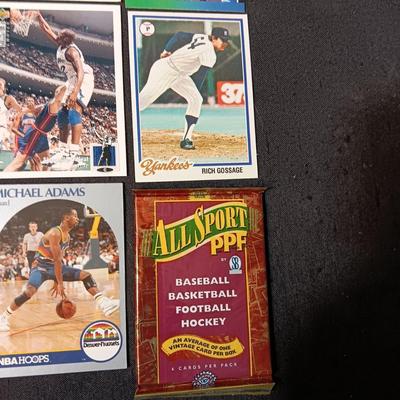 A VARIETY OF SPORTS TRADING CARDS