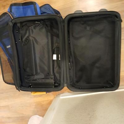 Two suitcases, and several small bags -