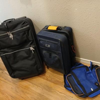 Two suitcases, and several small bags -