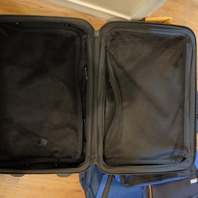 Two suitcases, and several small bags -