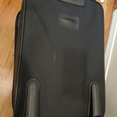 Two suitcases, and several small bags -