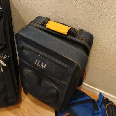 Two suitcases, and several small bags -
