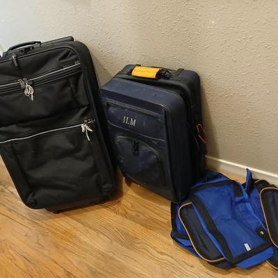 Two suitcases, and several small bags -