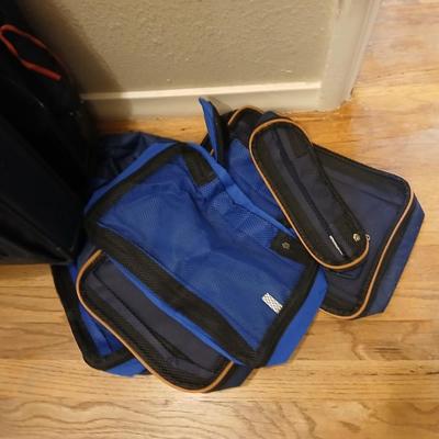 Two suitcases, and several small bags -