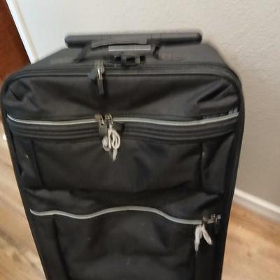 Two suitcases, and several small bags -