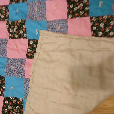 Handmade baby quilt with vintage baby blanket with stitched edging