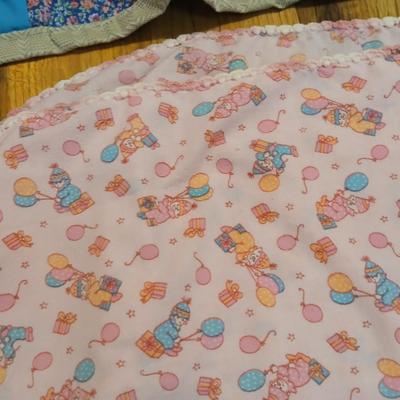 Handmade baby quilt with vintage baby blanket with stitched edging