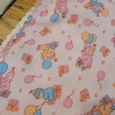Handmade baby quilt with vintage baby blanket with stitched edging