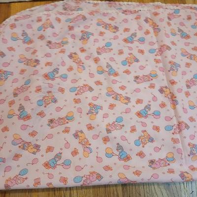 Handmade baby quilt with vintage baby blanket with stitched edging