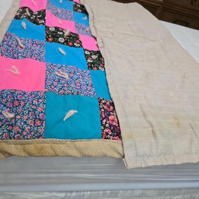 Handmade baby quilt with vintage baby blanket with stitched edging