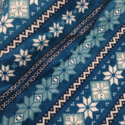 Twin sized bedspread with pillowcases with a Soft Twin blue blanket, a decorative pattern throw, and a quilted Doiley