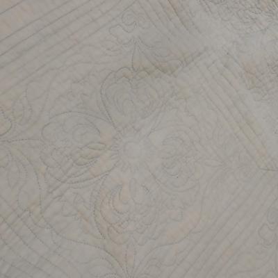 Twin sized bedspread with pillowcases with a Soft Twin blue blanket, a decorative pattern throw, and a quilted Doiley