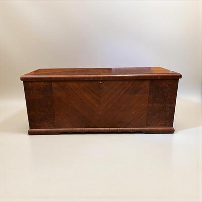 Sale Photo Thumbnail #31: Art Deco Waterfall Design cedar lined blanket chest. Lane Cedar Chest.  Chest has some wear on the top.  Original key is still stapled to the bottom of the chest.  The brackets that hold the lid open are missing.
47"X18.5"X20.5"