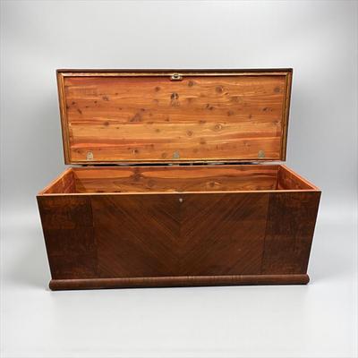 Sale Photo Thumbnail #34: Art Deco Waterfall Design cedar lined blanket chest. Lane Cedar Chest.  Chest has some wear on the top.  Original key is still stapled to the bottom of the chest.  The brackets that hold the lid open are missing.
47"X18.5"X20.5"