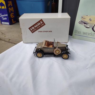DANBURY MINT MODEL A DIE CAST CAR, A WOODEN MODEL OF A CLASSIC COUPE & TIN SIGN
