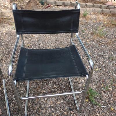 MID-CENTURY CHROME AND VINYL CHAIRS