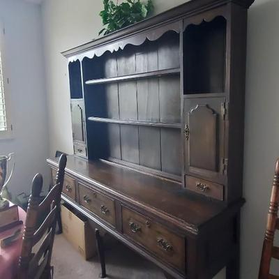 Sale Photo Thumbnail #43: Approx 6ft wide and 7 ft tall.  Solid wood. 2 opening cabinet doors , one on each side.  3 drawers. probably oak. the drawers appear to have an inlay design on them.