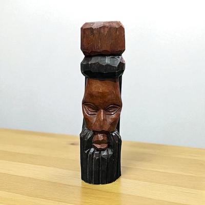 Sale Photo Thumbnail #94: Carved Wooden Face Statue.  Has name carved in top.  Has crack down one side.
9" Tall