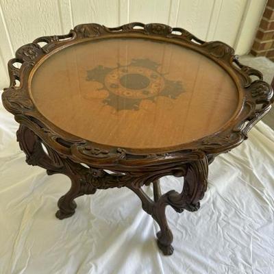 Sale Photo Thumbnail #16: Beautiful Victorian style hand carved coffee table. With wood inlay. And removable glass and wood top 26 inches in diameter and 20 inches tall.