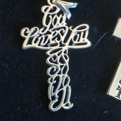 Four beautiful cross pendants - God Loves You - In God we Trust - rhinestone - and design crosses