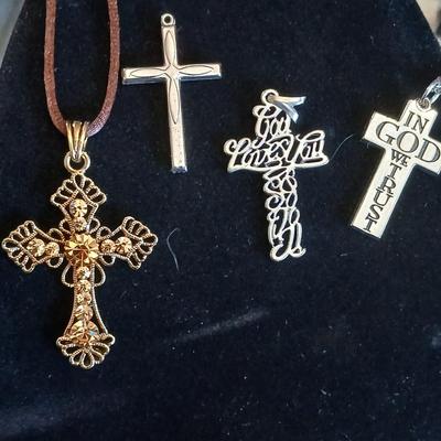 Four beautiful cross pendants - God Loves You - In God we Trust - rhinestone - and design crosses