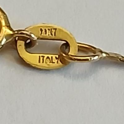 14 Kt marked bracelet with Amythyst 14 KT marked earrings