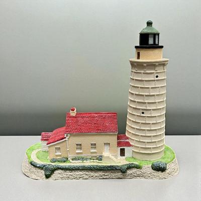 Sale Photo Thumbnail #133: Harbour Light Cana Island Lighthouse and Box.  #119   This lighthouse was introduced in January 1992 and retired in September 1995.  It includes the Certificate of Authenticity
Approximately  6.5" Tall